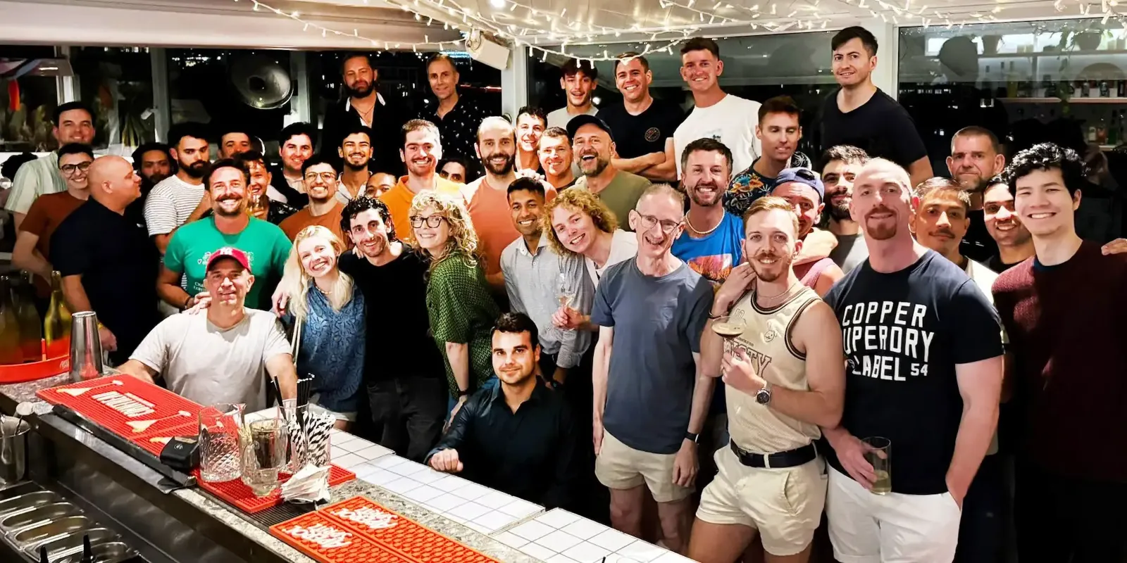 Crowd of people at an SQS Sydney Queer Social gathering